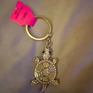 Brand new with tags Bling shiny white diamond look crystal turtle 🐢 keychain.